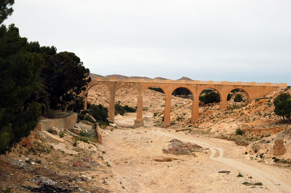 Tunisian railroad crossing a wadi approaching Fériana