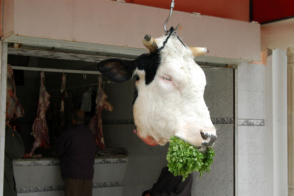 The beef at this butcher shop is so fresh, the cow still has a mouthful of grass