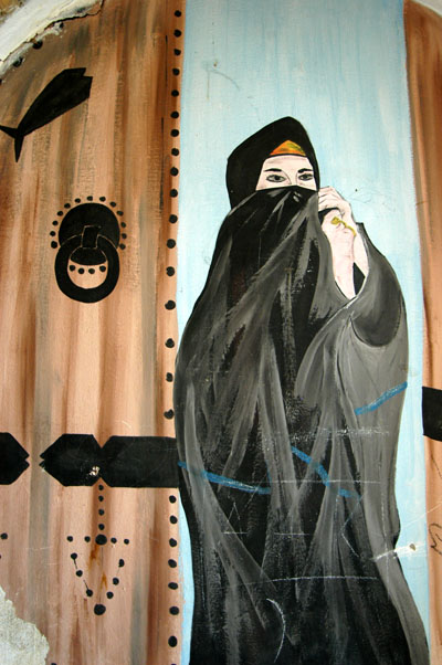 Wall mural of a woman in an abbaya