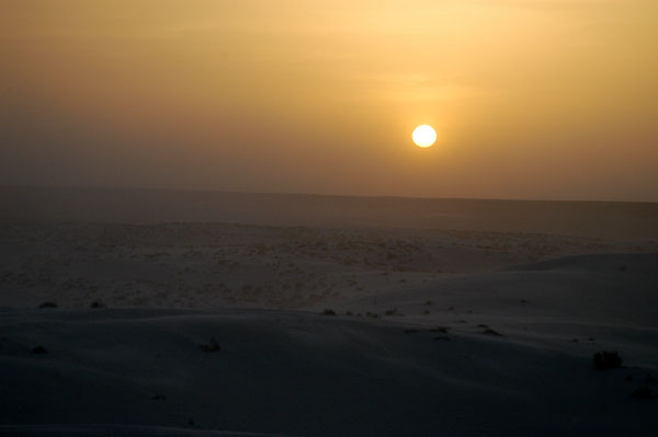 Hazy skies from dust kicked up by the strong winds made the sunset less than hoped for