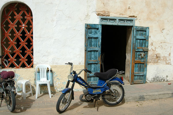 Motorbike and blue doors, Douz