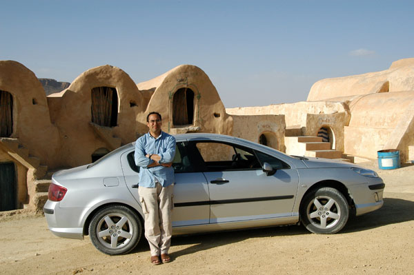 Slim with his luxury car for the week