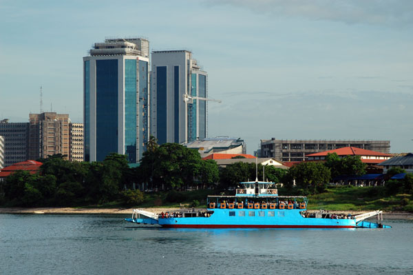 Twin towers of the Bank of Tanzania, Dar es Salaam with a local ferry
