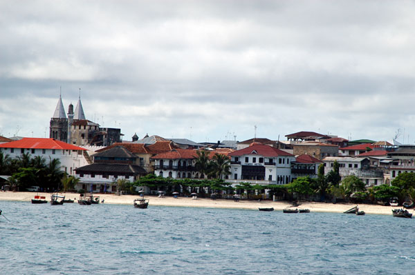Stone Town beach at Tembo Hotel with towers of St. Joseph's Cathedral on left