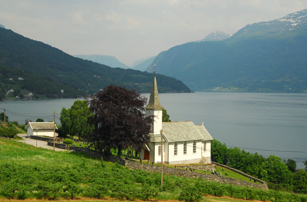Wooden church on the banks of the Lustrafjorden