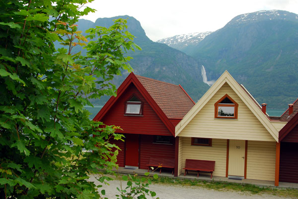 Tourist huts on the shore of Lustrafjorden across from Feigumfossen
