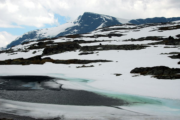 Partially frozen pond, Jotunheimen