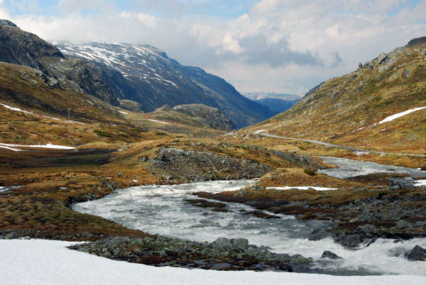 Snowmelt fed river flowing down the valley from Jotunheimen
