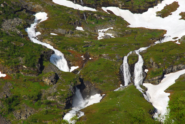 Numerous waterfalls on the side of Vinsshornet descending towards Geiranger