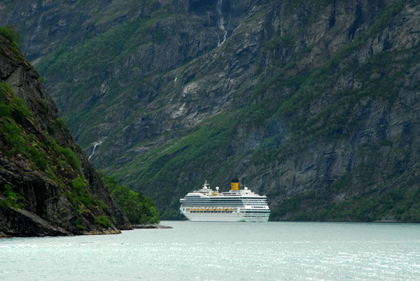 Cruise ship heading around a bend in Geirangerfjord