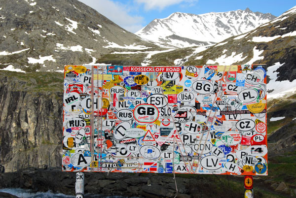 Top of Trollstigen - a sign covered with nationality stickers