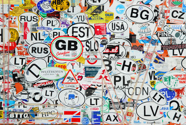 Car nationality stickers at the top of Trollstigen