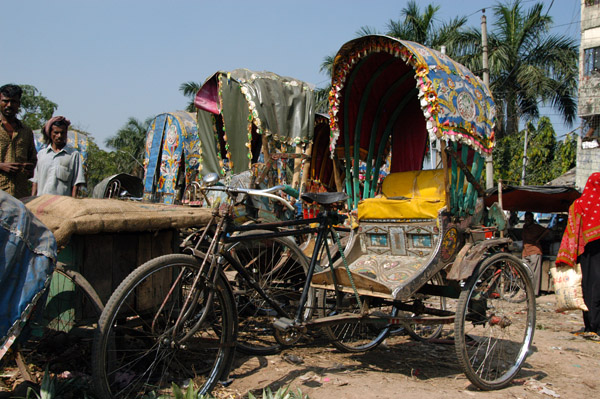 Rickshaws pulled up along the river, Old Dhaka