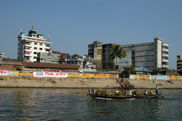 Along the river downstream from old Dhaka with what I believe is a textile factory