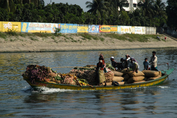 A boat fully laden with produced headed to market in Dhaka