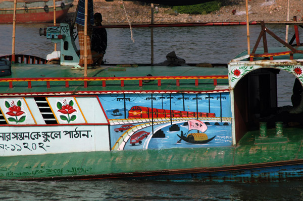 River boat painted with scenes of Transport in Bangladesh (rail, water, road)