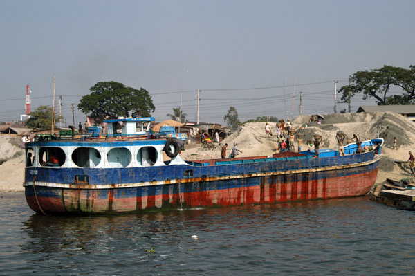 One of the Bangladeshi sand freighters unloading its cargo next to the Fatulla ferry pier