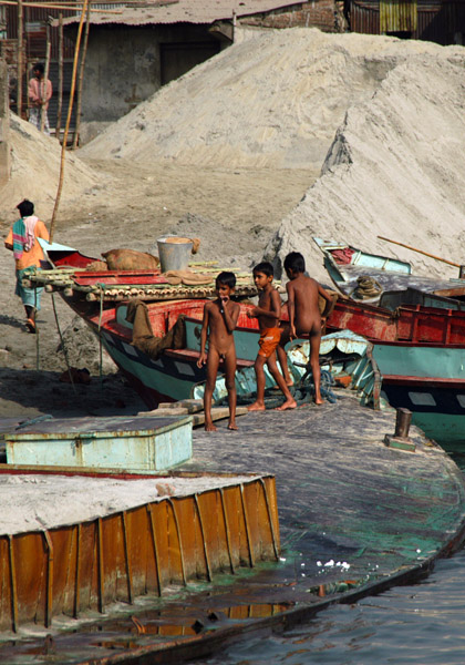 Naked boys playing on a loaded sand freighter, Fatulla