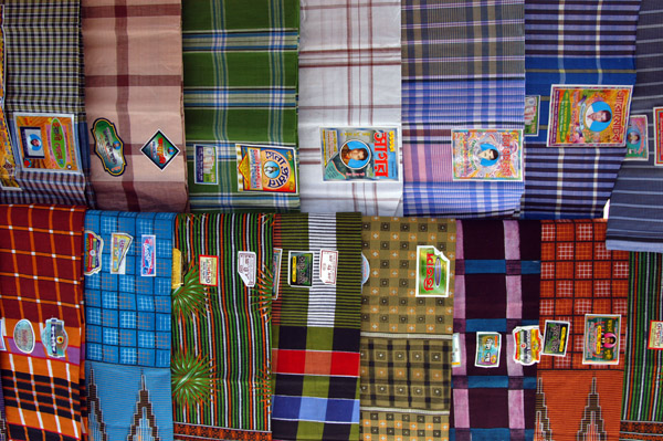 Market stall selling the colorful sarongs the men often wear in Bangladesh