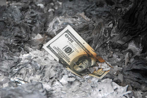 Burnt offerings to the ancestors - a (fake) US$100 bill