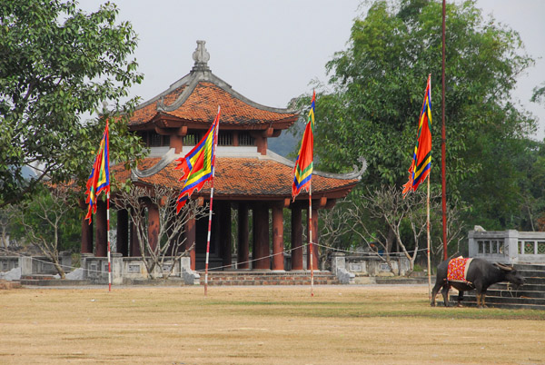 Small pagoda with festival flags at the parking area, Hoa Lu