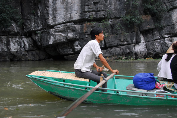 Most of the paddlers are women, but some are men, Tam Coc