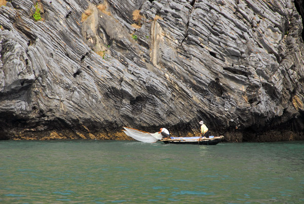 Net fisherman operating from a traditional rowboat, Cat Ba Island