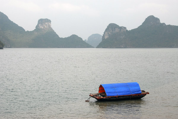 Small tarp covered boat, Halong Bay