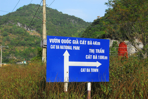 Road sign at a junction, Cat Ba Island - 18km back to town