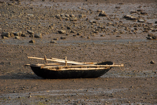 Traditional Vietnamese row boat at low tide, Cat Ba Island