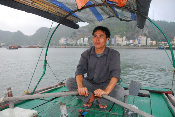 The boatman I hired for a one hour sunset cruise around the floating village