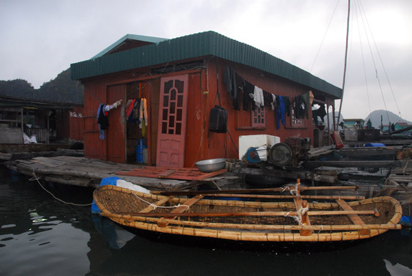 This floating village house has its own generator - most others seem battery operated