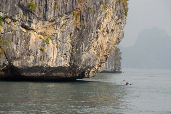 The seawater has eroded the limestone formations in Halong Bay