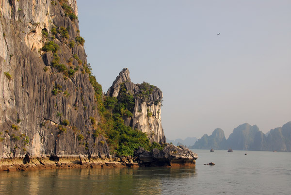 Passing close to one of the limestone islands, Halong Bay