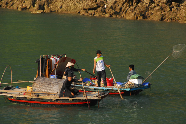Small boats, complete with laundry rack, Halong Bay