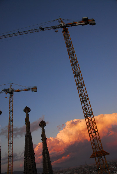 Cranes over Sagrada Família, sunset