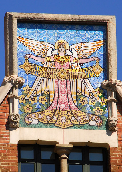 Colorful tile angel on top of  Casa de las Punxes, Barcelona