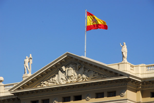 Pediment of the Gobierno Militar, Barcelona, flying the flag of Spain