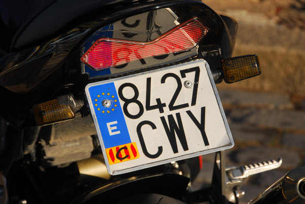 Motorbike with a Spanish license plate and Catalonia sticker