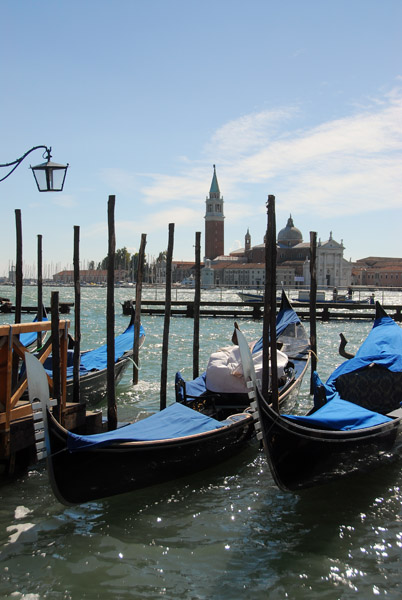 A pair of gondolas in front of the Doges Palace
