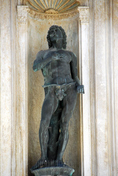 Bronze statue of Adam by Antonio Rizzo in a niche on east side of the the Foscari Arch