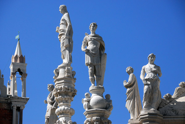 Statues on top of the Foscari Arch representing the Liberal Arts seen from the upper level of the east wing of the Doge's Palace