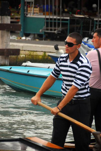 Young Venetian gondalier in the traditional striped shirt