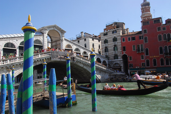 Gondola rowing under the Rialto Bridge, Venice