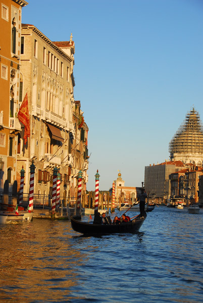 Gondola on the Grand Canal with the domes of the Basilica of Santa Maria della Salute
