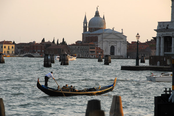 Gondola on the choppy water at the mouth of the Grand Canal with il Redentore on Giudecca