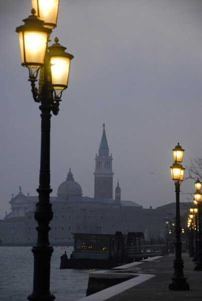 Antique street lamps on Giudecca with the tower of San Giorgio Maggiore