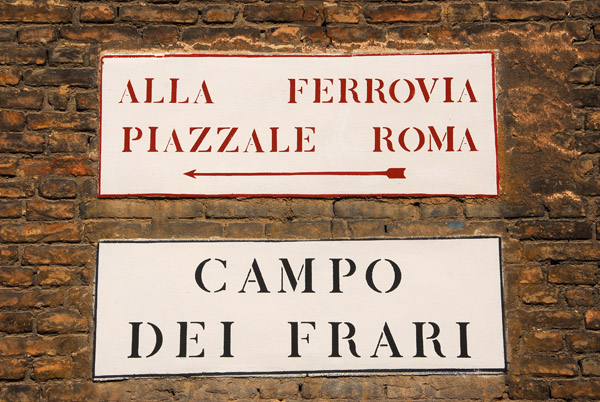Campo Dei Frari with a sign for the Railway Station (Ferrovia) at Piazzale Roma