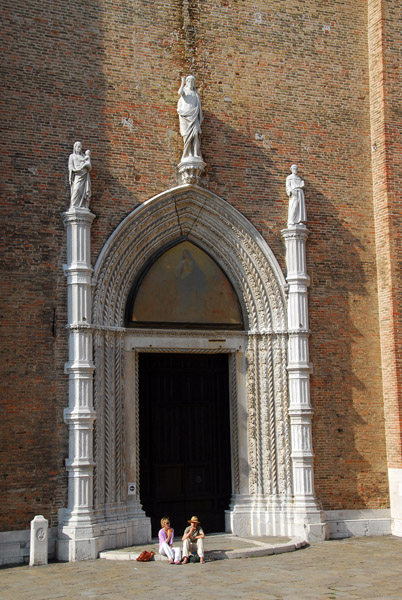 Main portal of I Frari in the center of the northeast facing main faade