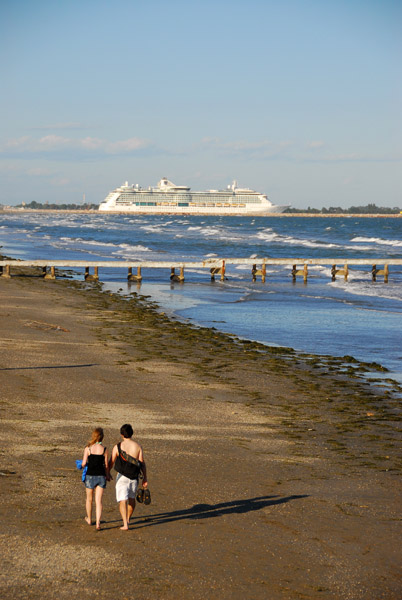 ...walking on the beach in Lido as a cruise ship heads out to sea